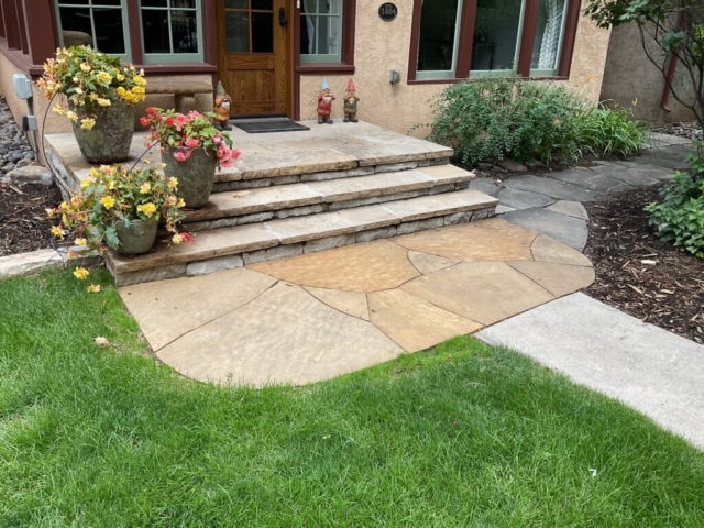 Concrete path was cut out and replaced with tightly fitted, dry-laid flagstone landing.