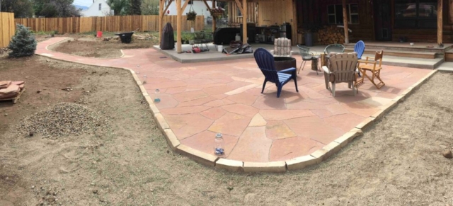 Large flagstone patio and flagstone walkway with stone borders