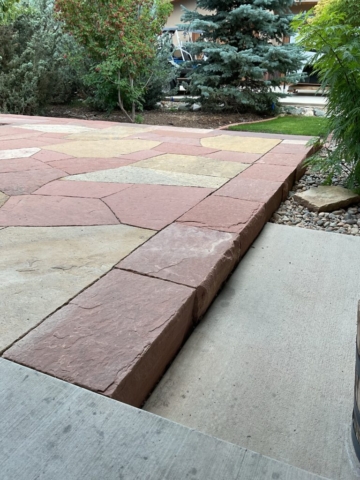two tone flagstone patio with robust sandstone block edging